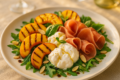 Insalata di pesche grigliate, burrata e prosciutto crudo